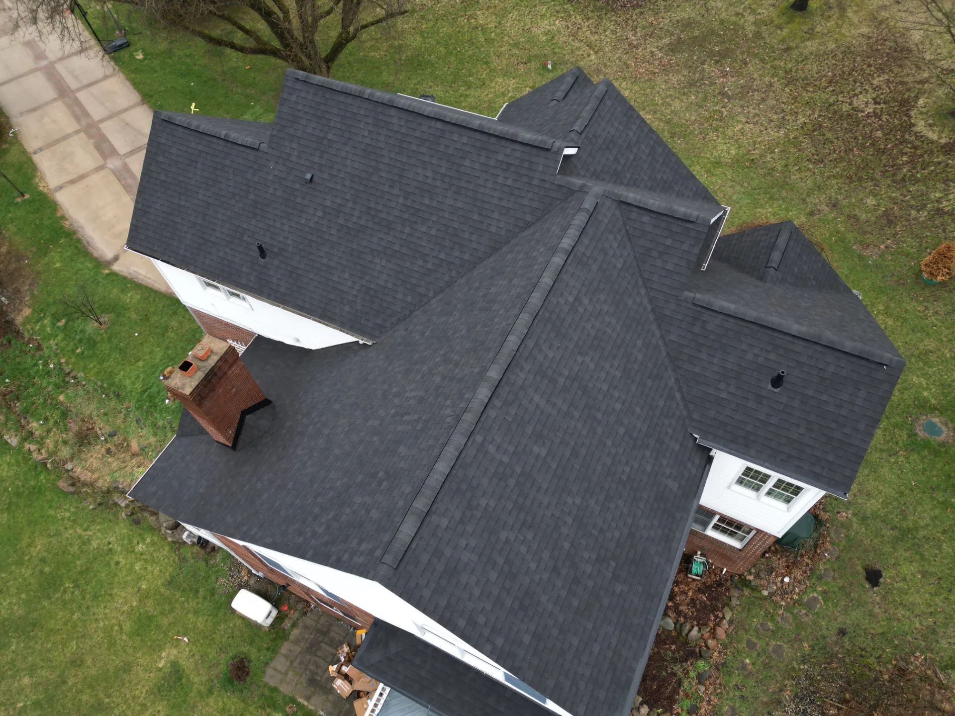 Roof Replacement in Leonard with Atlas Pinnacle Pristine Black Shadow shingles — photo 9 of 13