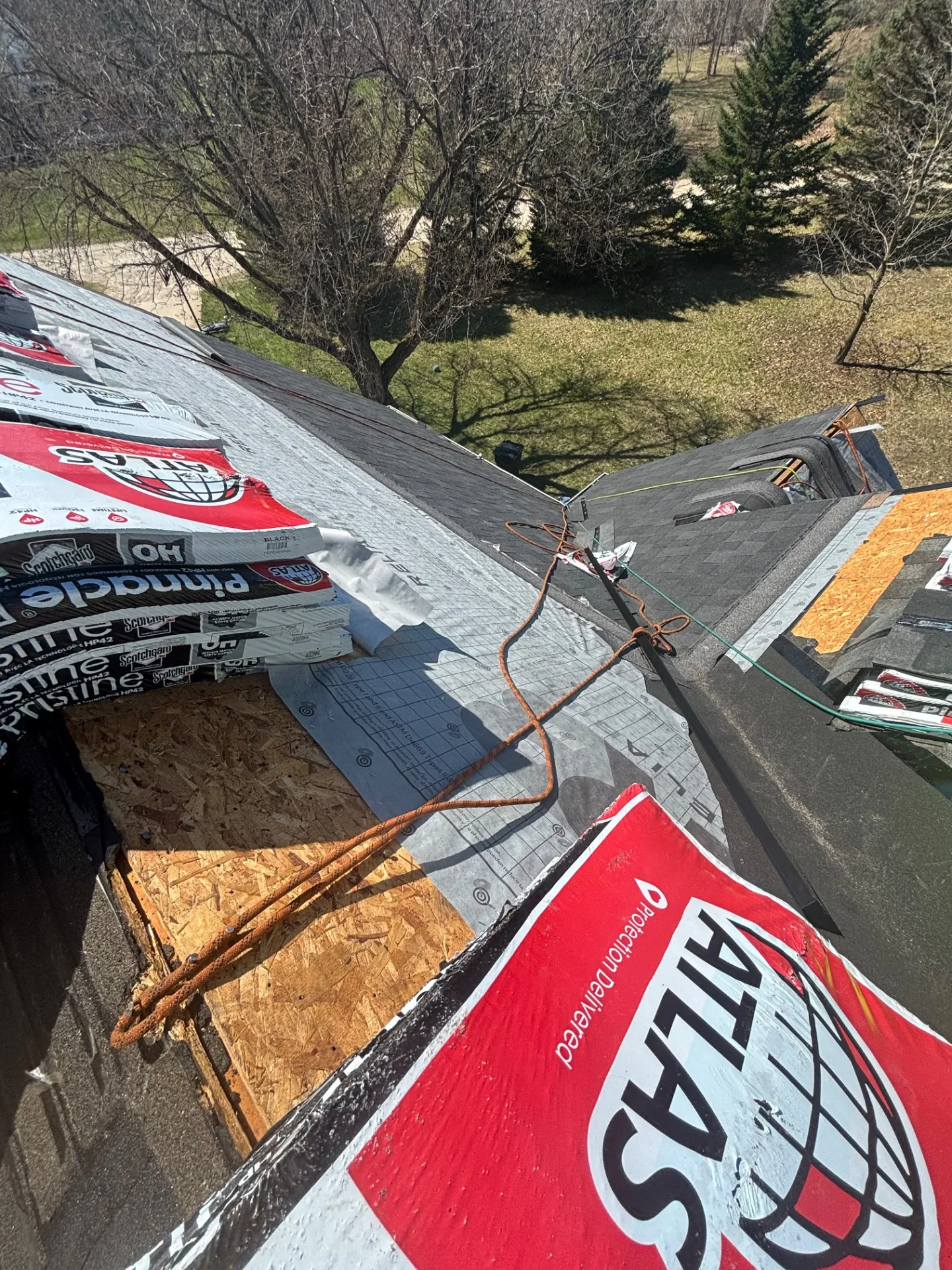 Roof Replacement in Leonard with Atlas Pinnacle Pristine Black Shadow shingles — photo 1 of 13